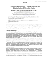 Curvature dependence of lasing wavelength in a flexible InGaAsP microdisk cavity