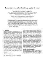 Temperature-insensitive fiber Bragg grating tilt sensor