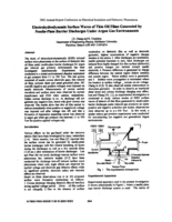 Electrohydrodynamic surface waves of thin oil films generated by needle-plate barrier discharges under argon gas environments